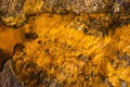 Top view shot of water flowing over the rock in a river bed in Rio Tinto mining park Royalty Free Stock Photo