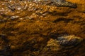 Top view shot of water flowing over the rock in a river bed in Rio Tinto mining park Royalty Free Stock Photo