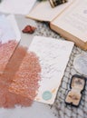 Top view shot of wedding invitation drafts with DIY Copper Mesh and blur book and rings