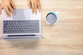 Top view shot of wooden desk of business woman is typing on computer laptop which working via internet technology shows concept of Royalty Free Stock Photo