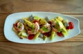 Top view of shrimp with melon and mixed fruit Thai style spicy salad dish on wooden table Royalty Free Stock Photo