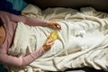 Top view Sick woman holding mug of warm sea buckthorn tea