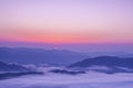 The top view of the silhouettes and peaks of the mountains at dawn, sunset,