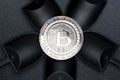Top view silver bitcoins crypto coin over black shovel mining on
