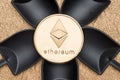 Top view silver ethereum crypto coin over black shovel mining on