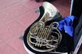 Top view of a silver French horn in a music box for a marching band or jazz band.