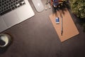 Top view simple workplace with laptop computer, coffee cup, and potted plant on wooden background