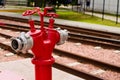 Top view of the single red fire hydrant, which standing on the pavement near rails. Royalty Free Stock Photo