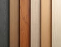Top view of six vertically oriented MDF material boards in various colors, wood grain patterns. Colors range from dark grey to Royalty Free Stock Photo
