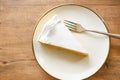 top view of slice of cheese cake in a plate on table Royalty Free Stock Photo