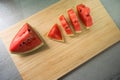 Top view slice of watermelon on wood board in kitchen