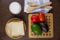 Top view sliced bread toped with condensed milk on wooden plate and fresh milk Royalty Free Stock Photo