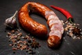 top view sliced circle of dry smoked sausage with garlic and chili Royalty Free Stock Photo