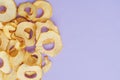Top view of sliced dry healthy snack apple on violet background. Health lifestyle food. Homemade sweets and dessert. Organic food Royalty Free Stock Photo