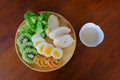 Top view of Sliced egg salad serve with vegetable, kiwi, tomato, crispy bread and separated sesame dressing Royalty Free Stock Photo