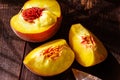 Top view of sliced peaches with a knife on a wooden table Royalty Free Stock Photo