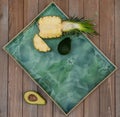 Top view of sliced pineapple with avocado on a chopping  board Royalty Free Stock Photo