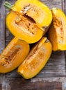 Top view sliced pumpkin on wooden background