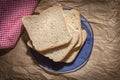 Top view of the sliced rye bread on a blue plate Royalty Free Stock Photo