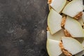top view of sliced sweet ripe honeydew melon on black Royalty Free Stock Photo