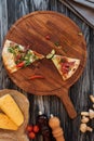 top view of slices of delicious pizza on wooden