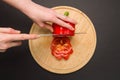 Top view of slicing red pepper on chopping board Royalty Free Stock Photo