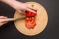 Top view of slicing red pepper on chopping board Royalty Free Stock Photo