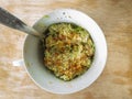 Top view on small cup filled with handmade guacamole spread