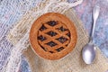 Top view of small homemade tartlet called `Linzertorte`, a traditional Austrian shortcake pastry topped with fruit preserves Royalty Free Stock Photo