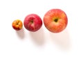 small and medicum and big size apples on a white background Royalty Free Stock Photo