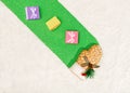 Top view of a small ornamental glove with tiny gift boxes on a green surface covered in fake snow Royalty Free Stock Photo