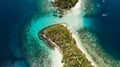 Top view of small tropical island in the Philippines. Island hopping tour in Port Barton Royalty Free Stock Photo