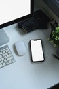 Top view of smartphone with blank screen on modern white desk workspace Royalty Free Stock Photo