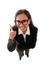 Top view of smiling asian businesswoman with eyeglasses pointing finger up, isolated on white background