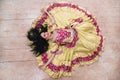 Top view. smiling young woman performing passionate Gypsy dance.