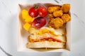 snack of sandwich and deep fried diced chicken and grape and mangoes and sweet potatoes Royalty Free Stock Photo
