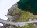 Top view of snow road Aurlandsvegen with car and motorcycles having involuntary stop during travelling. Norway, Scandinavia