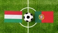 Top view soccer ball with Hungary vs. Portugal flags match on green football field Royalty Free Stock Photo