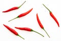 Top view some of the red chili or Jinda Chili in Thai language, close up image, arranged fresh chili as a pattern on white