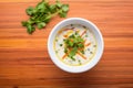 top view of soup with sour cream swirl and cilantro garnish