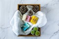 Top view of spa box with organic handmade soap bars with marble background