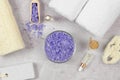 Top view spa composition. Bowl with lavender sea salt and bath accessories