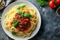 Top view of Spaghetti Bolognese in a white plate on black slate background with copy space. Italian pasta with minced Royalty Free Stock Photo