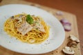 Tilted angle top view of spaghetti carbonara lunch dinner meal Royalty Free Stock Photo