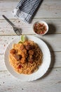 Top view of spaghetti pasta and meatballs in a plate along with condiments Royalty Free Stock Photo