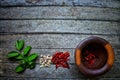 Top View Of Spices Chili Peppers Garlic Lemon Green Leaf And Mortars On Vintage Wood Table Style Background