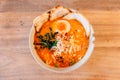 Top view of Spicy Chashu Miso Ramen: Japanese noodle in vegetable broth mix Miso paste with Chashu pork, sprouts, minced pork.