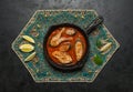 Top view of spicy and hot Bengali fish curry. Indian food. Fish curry with red chili, curry leaf, coconut milk. Asian cuisine. Royalty Free Stock Photo
