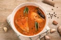 Top view of spicy and hot king fish curry with green curry leaf Royalty Free Stock Photo