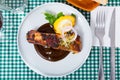 Top view of pork ribs in chocolate sauce with baked potatoes Royalty Free Stock Photo